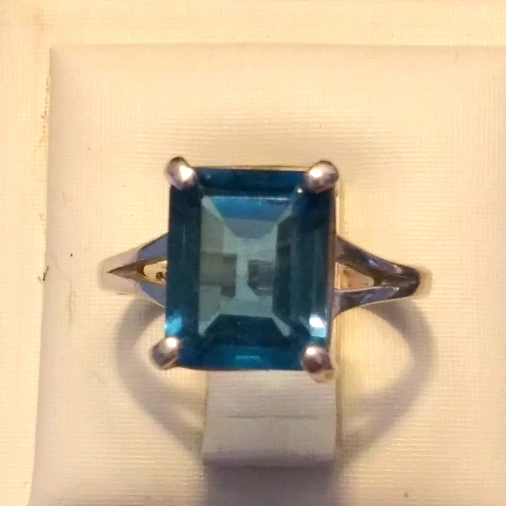 Emerald cut blue ring